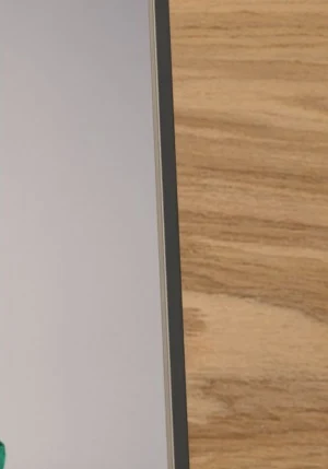 Accepted cut, the same edge: the stacked edges of real pages over a dark board.