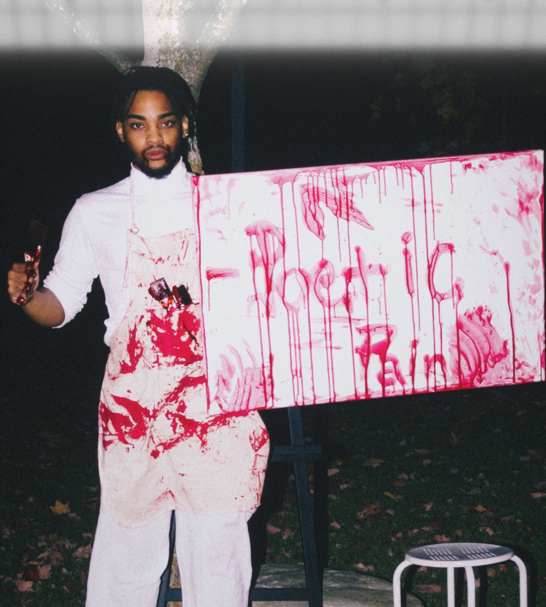 A large print hangs in white inspection light: a person in a white apron splashed with red holds a dripping painted sign.