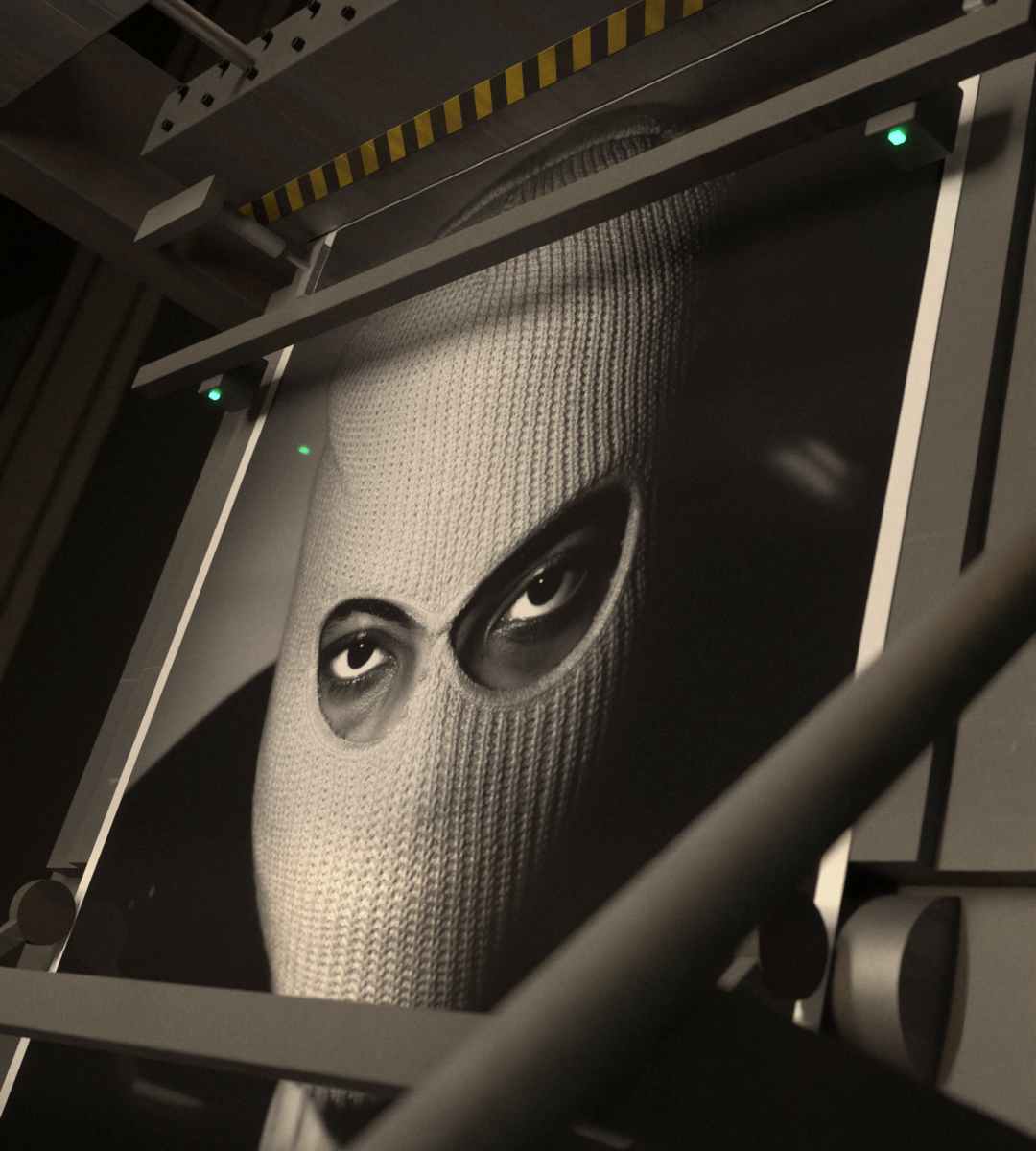 The balaclava self-portrait is fed under the blade beam, the eyes looking up.